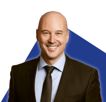 Portrait of Luc Charbonneau on a blue background