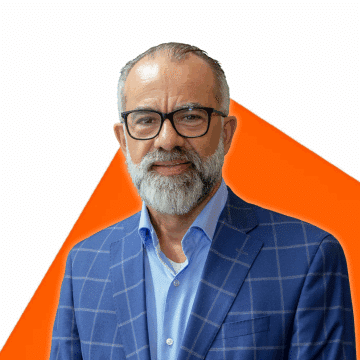 Portrait of Louis Dubé on an orange background